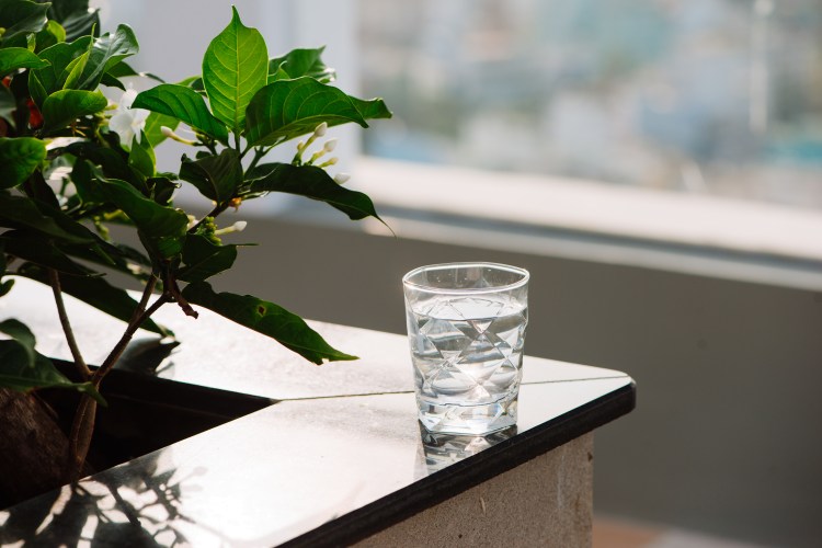 Closeup Glass of water on table nature background